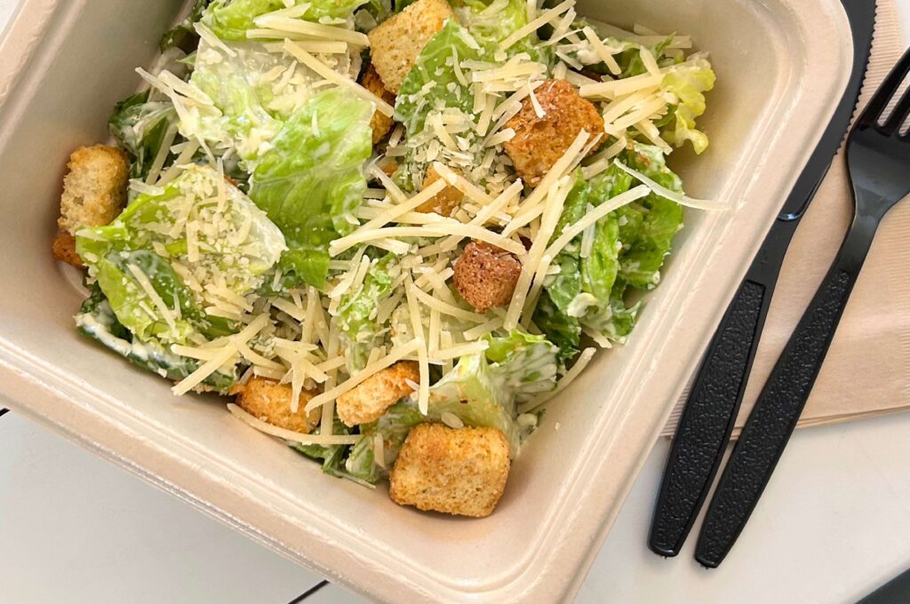 EcoFibre container top view with cesar salad